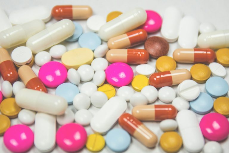 assorted medication tables and capsules; marketing pharmaceutical company